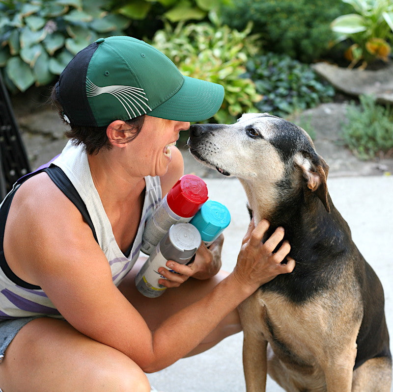 Annette Fiscelli, founder and designer at LINKS by Annette takes a break from making handmade goods from retired bike parts in Chicago. With her dog Jack and spray paint. 